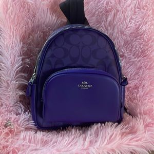 Purple Coach mini back pack.  New with tags